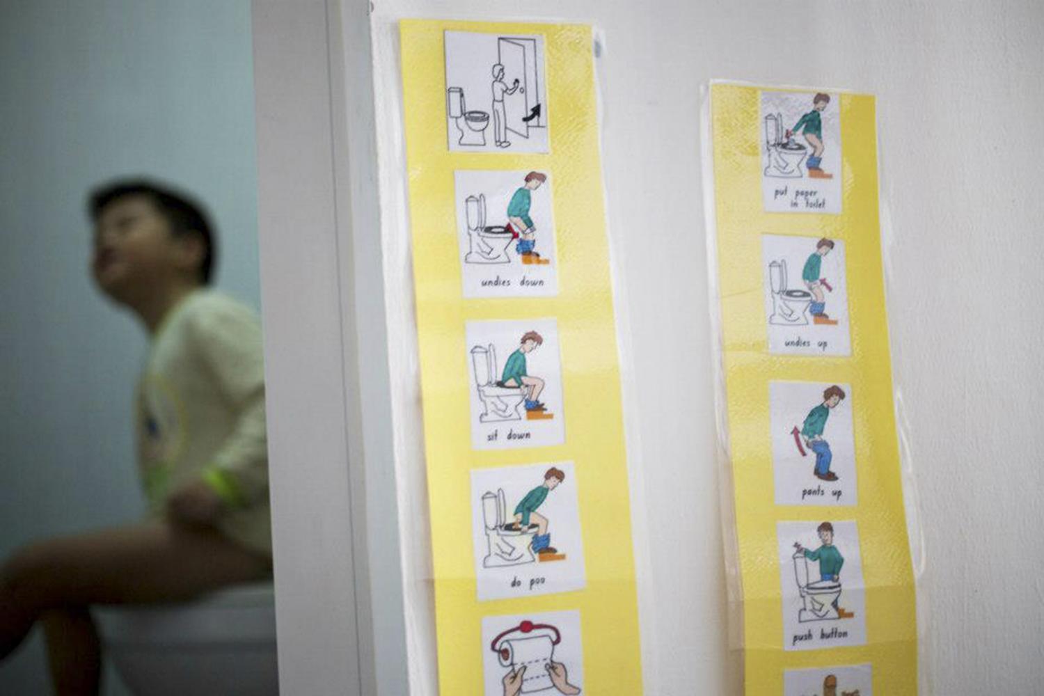 His occupational therapist prepares a set of instructions with pictures which we use to teach Jun Le how to use the toilet on his own and develop good personal hygiene habits.