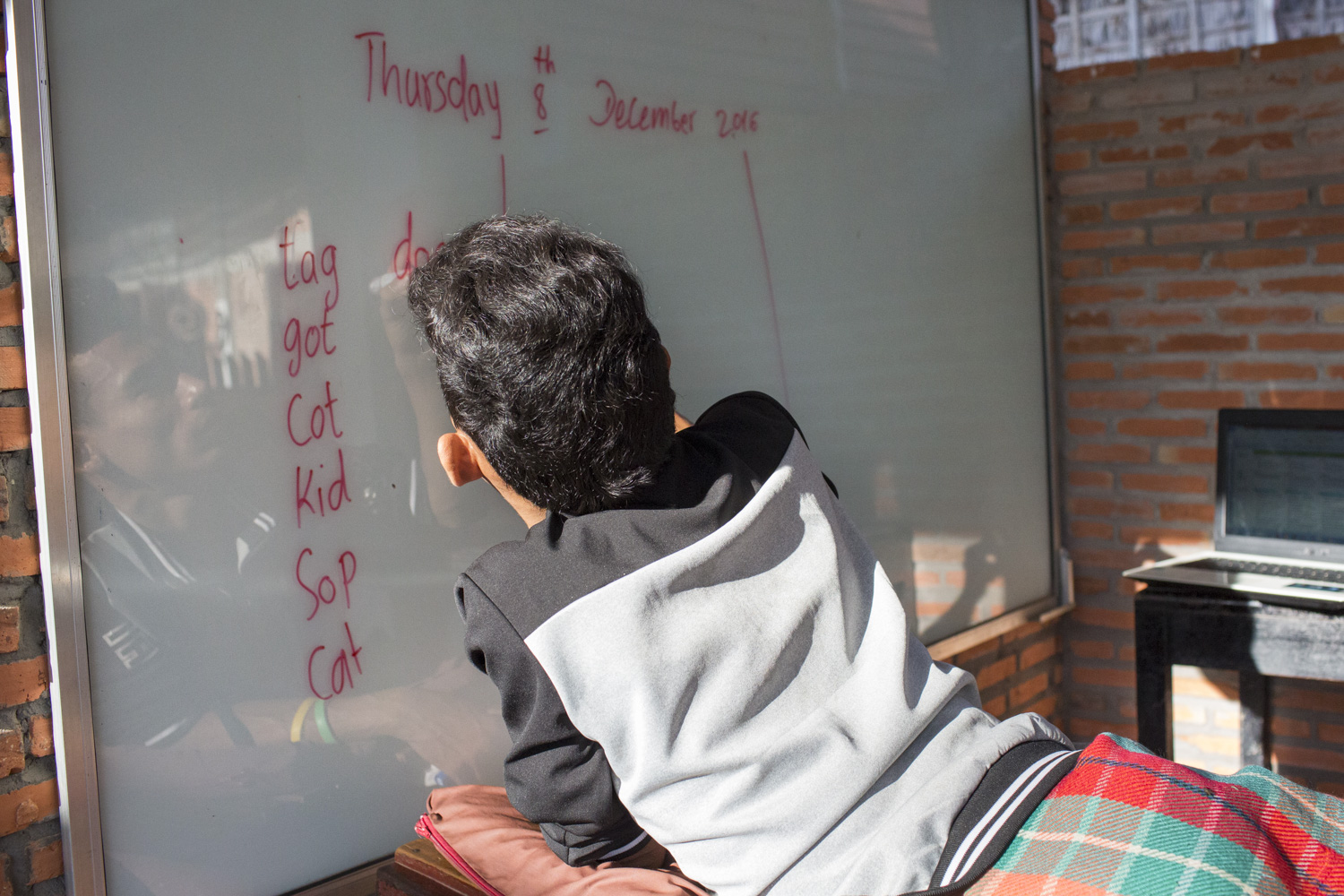 Sophanna preparing for class before his students arrive.