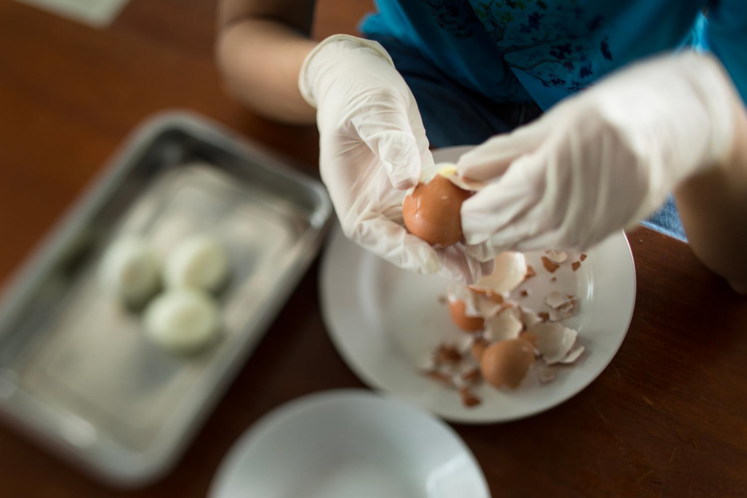 For Luqman, tasks like washing the rice and peeling eggs help to develop his fine motor skills.   After six months, Luqman is now able to pack nasi lemak without assistance.