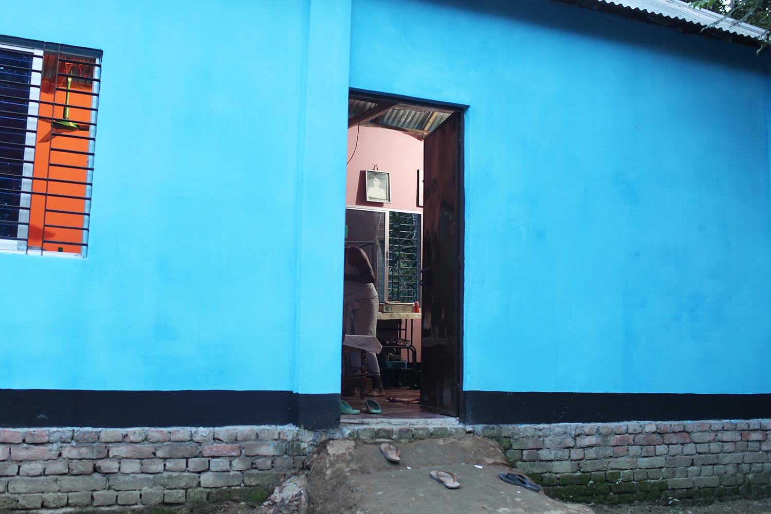 Home is where the heart is: a portrait of Rasel is pinned up on the wall of his family's home