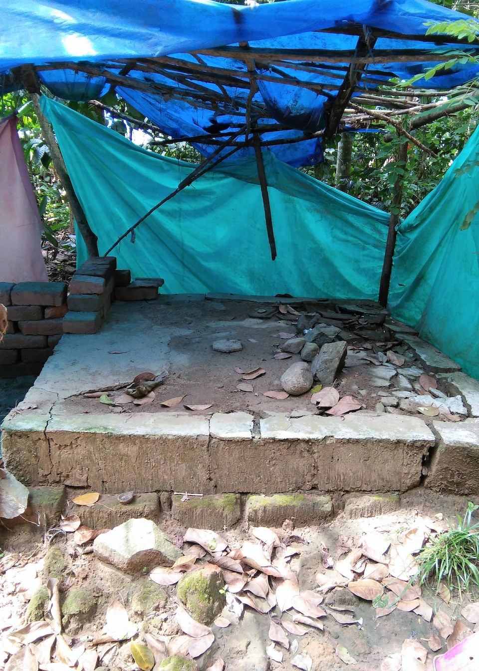 The house of Smitha and her husband A Ramesh (left)  was so badly damaged during the floods that they had to put up plastic sheets for walls in the aftermath. With the help of SaveAGram, they built a new home with tin walls. Photo courtesy of SaveAGram